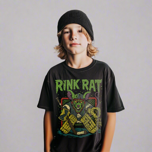 Child wearing a 'Rink Rat' t-shirt at an ice rink