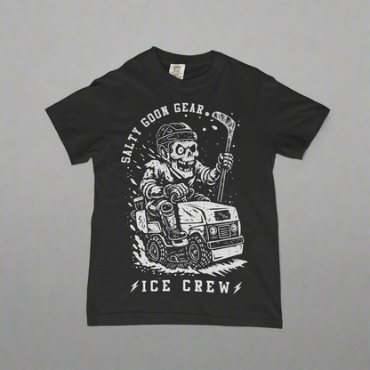 Black t-shirt with a graphic design of a skeleton driving a vehicle and text 'Salty Goon Gear Ice Crew' on a concrete surface.