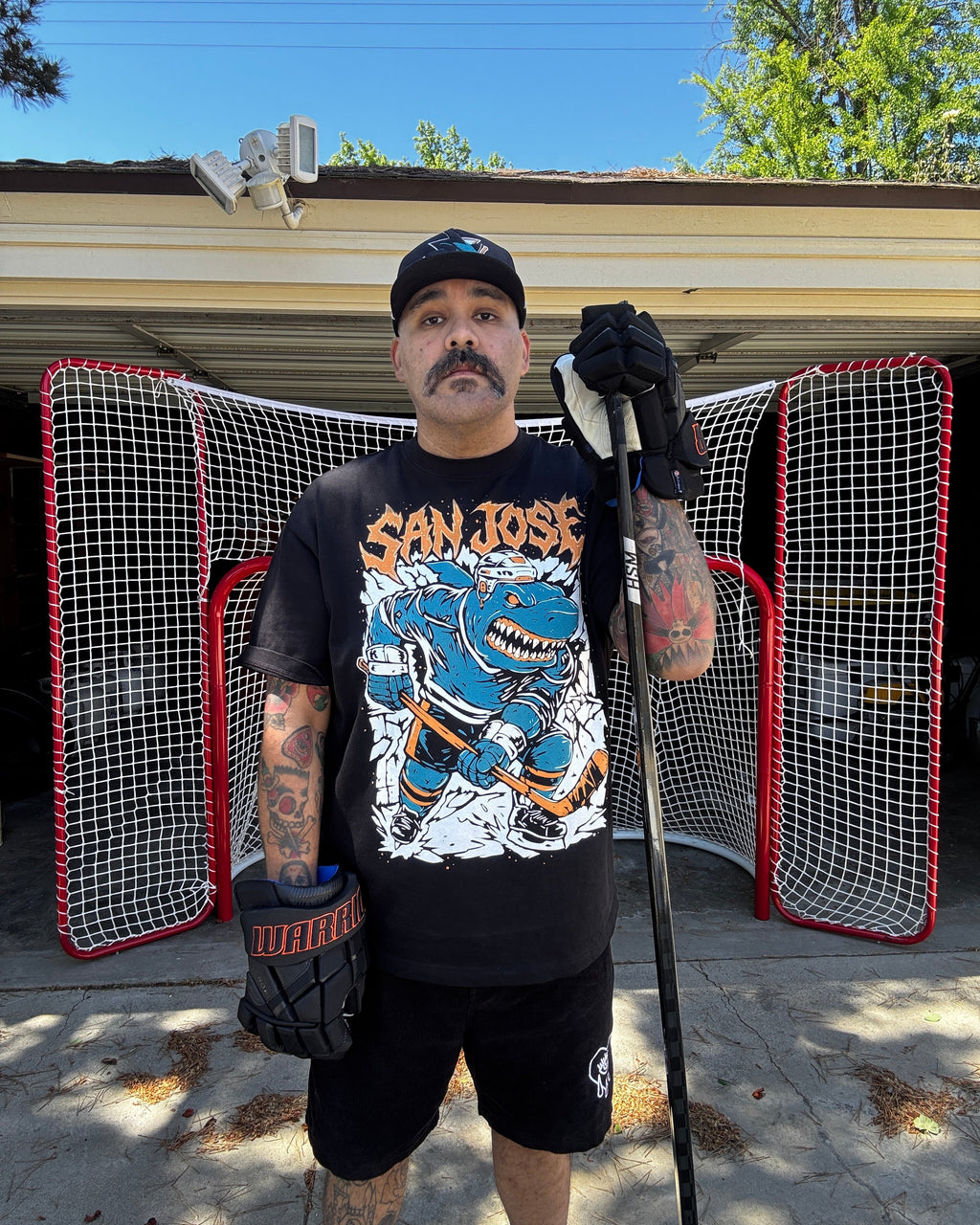 Millennial Man wearing San Jose Ice Hockey shirt, of an aggressive street shark hockey player enforcer 