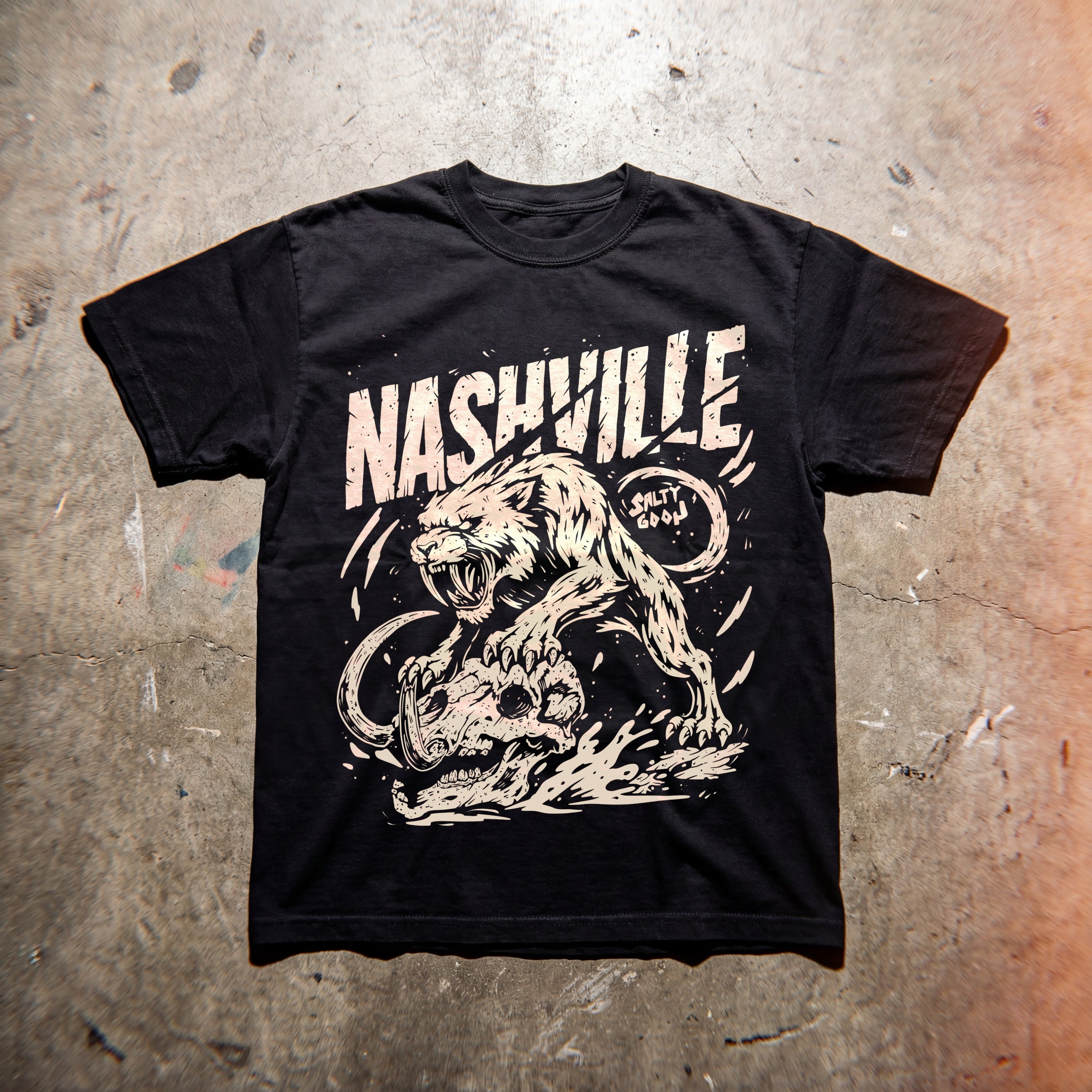 Black t-shirt with 'Nashville' and sabretooth tiger 