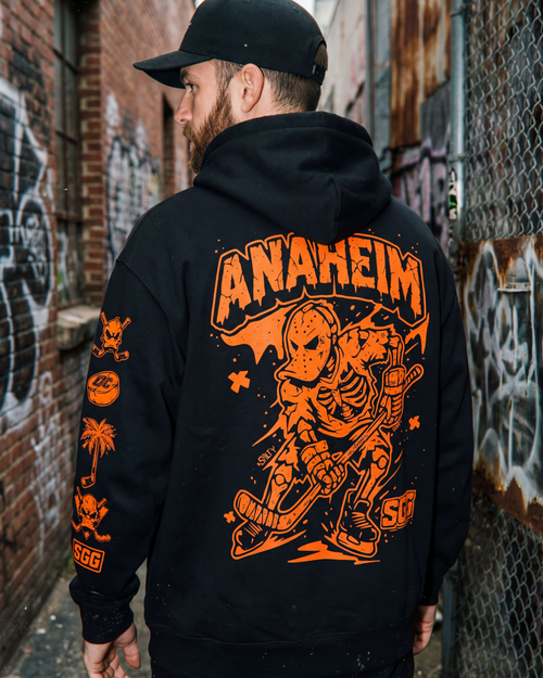 Anaheim Ice Hockey Hoodie, Black and Oragnge Heavyweight Hoodie, Large Skeleton Ice Hockey Character and ANAHEIM lettering arch'd above 