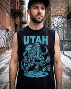 Man wearing a black sleeveless shirt with 'Utah' and a graphic design in an urban setting.